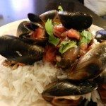 Mussels with red sauce and rice