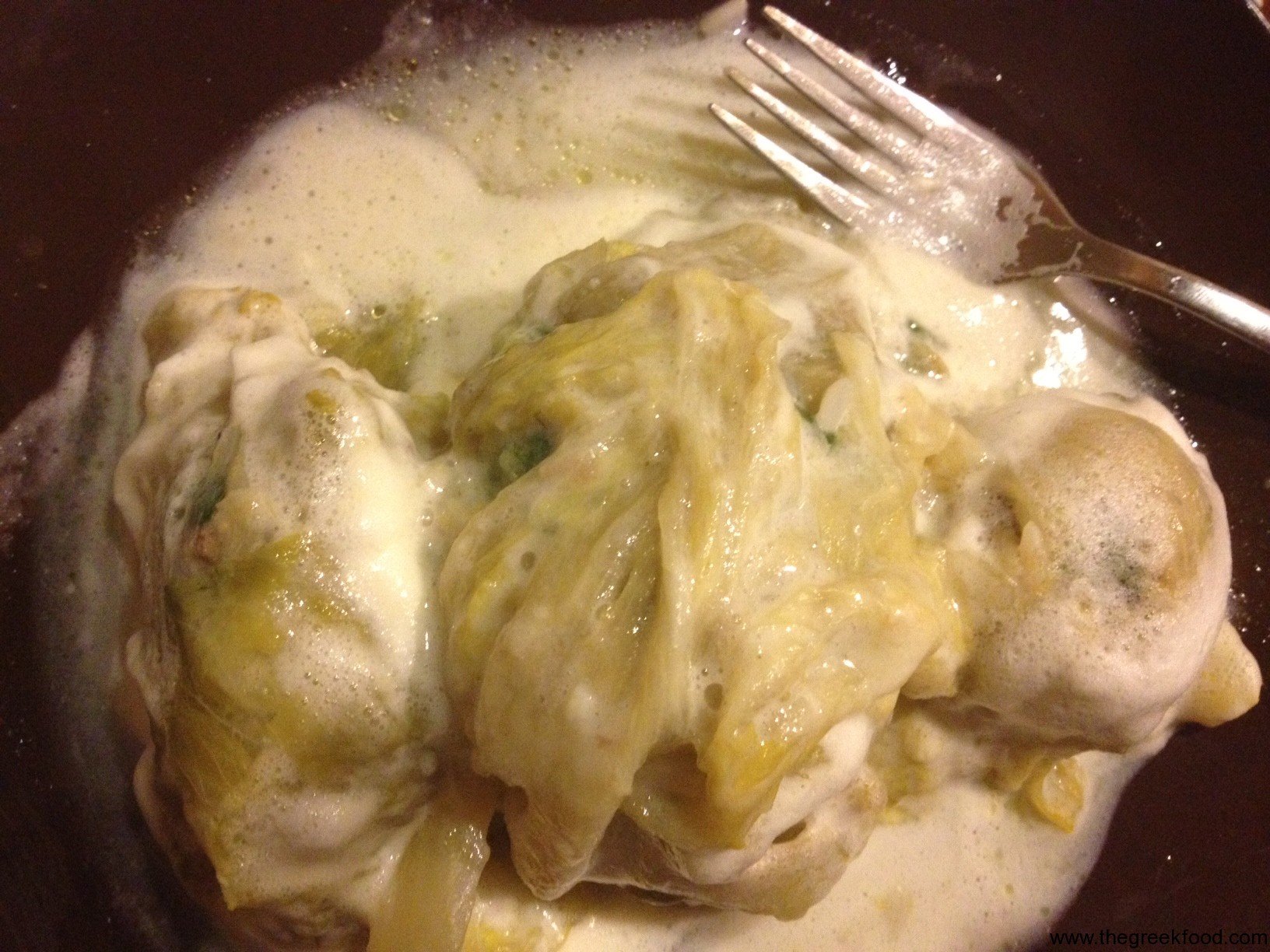 Making Lachanodolmades – stuffed cabbage leaves