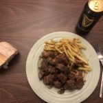 Pork with sausages in black beer